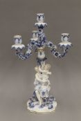 A 19th century Continental porcelain figural candelabra. 47 cm high.