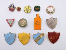 A quantity of enamel badges.