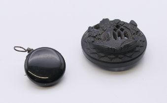 A bog oak brooch, and a Ketcham and McDougall patent retracting chatelaine brooch.