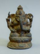 A 19th century Indian bronze model of Ganesh. 12.5 cm high.