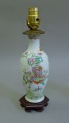 A 19th century Chinese porcelain lamp. 36 cm high overall.
