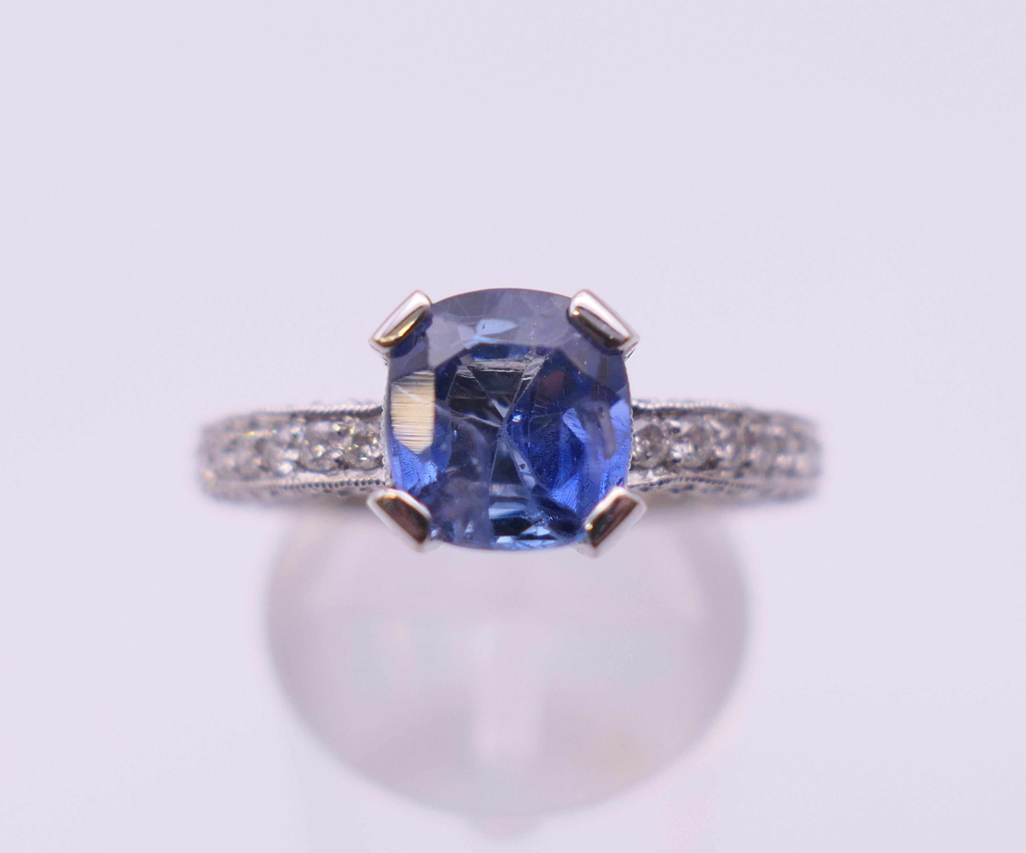 An 18 ct gold sapphire and diamond ring. Total diamond weight approximately 2.5 carats. - Image 2 of 11