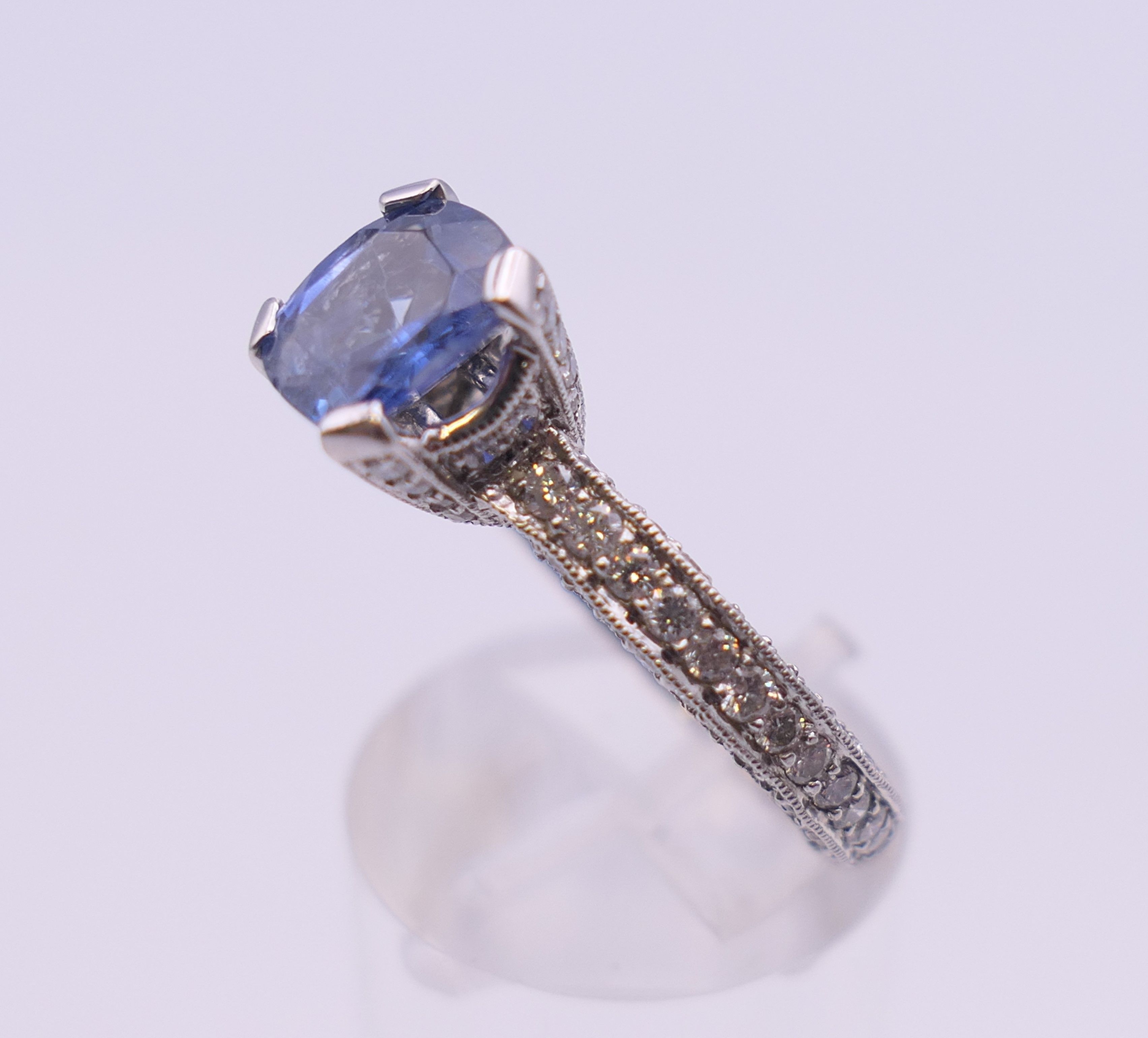 An 18 ct gold sapphire and diamond ring. Total diamond weight approximately 2.5 carats. - Image 5 of 11