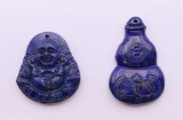 Two lapis pendants. The largest 4.5 cm high.