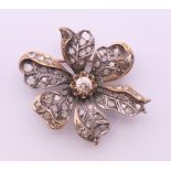 A Victorian unmarked diamond set floral brooch. 4 cm wide.