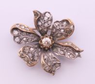 A Victorian unmarked diamond set floral brooch. 4 cm wide.