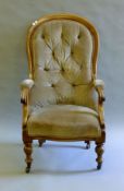 A Victorian mahogany framed spoon back open armchair. 62 cm wide.