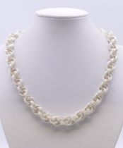 A Contemporary silver necklace. 44 cm long. 77.8 grammes.