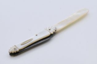 A 19th century mother-of-pearl combination quill cutter and letter opener. 12 cm long.