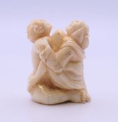 An erotic bone carving. 4 cm high.