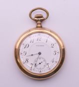 A gold plated Waltham pocket watch. 4.5 cm diameter.