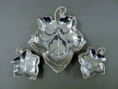 Three Spanish silver leaf dishes, each bearing faint marks. The largest 29.5 cm long. 456.6 grammes.