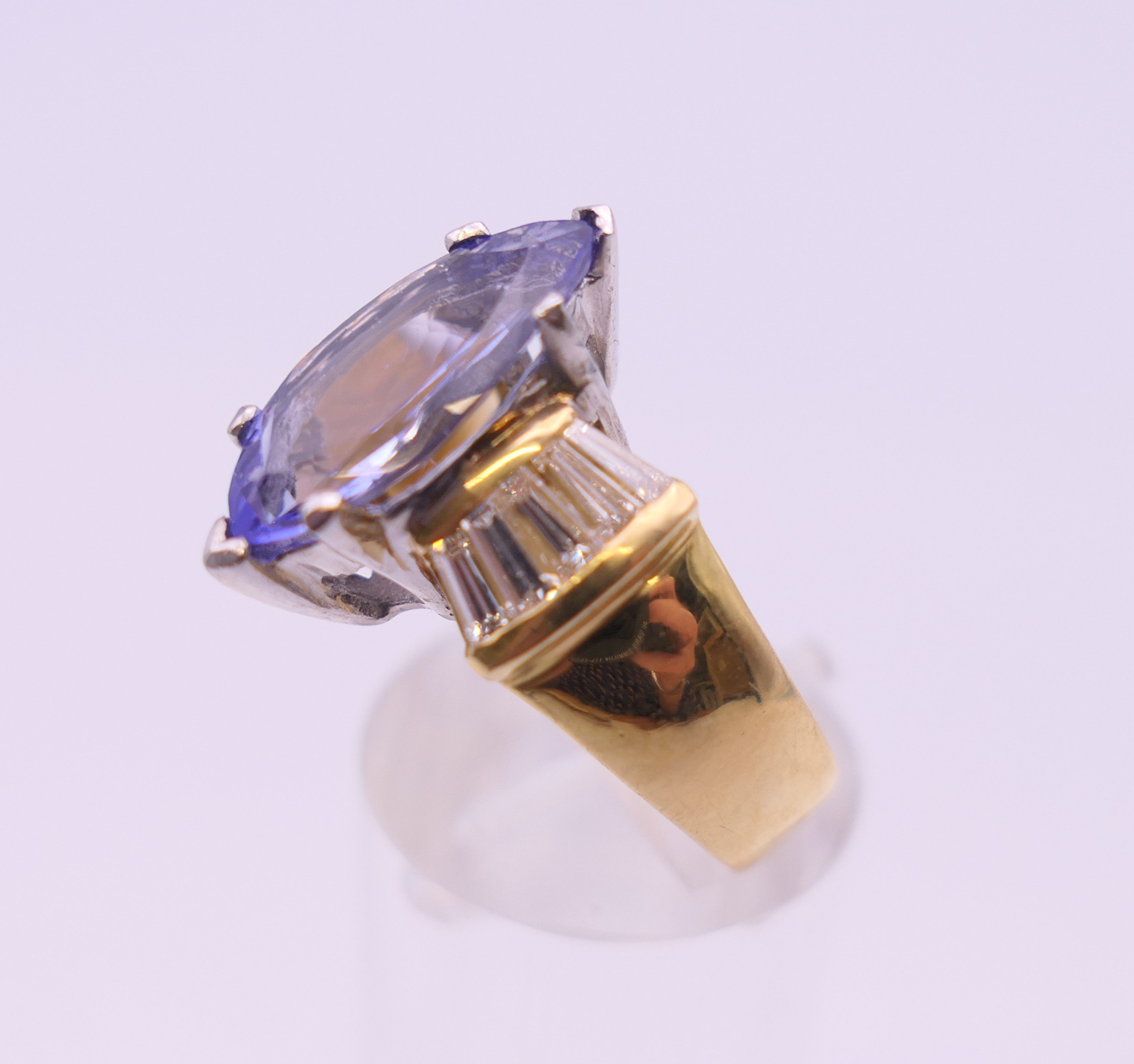 An 18 ct gold tanzanite and baguette diamond ring. Ring size O/P. - Image 3 of 8