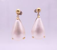 A pair of 18 K gold pearl set drop earrings, marked for Hirsch and Oppenheimer. 3 cm high. 4.