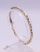 A 10 K gold diamond bracelet (with one link separated). 18.5 cm long. 6.8 grammes total weight.