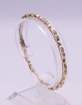 A 10 K gold diamond bracelet (with one link separated). 18.5 cm long. 6.8 grammes total weight.