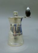 A Mappin & Webb silver plated milk churn form grinder. 10 cm high.