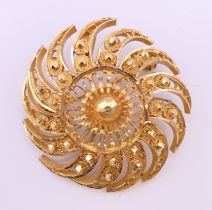 An unmarked high carat gold, probably 18 ct, Mogadishu Star brooch. 4 cm diameter. 17.5 grammes.