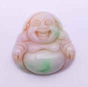 A jade Buddha pendant. 5 cm high.