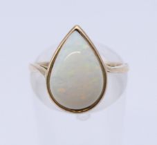 A 9 ct gold and opal ring. Ring size M.