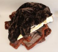 A quantity of vintage fur coats.