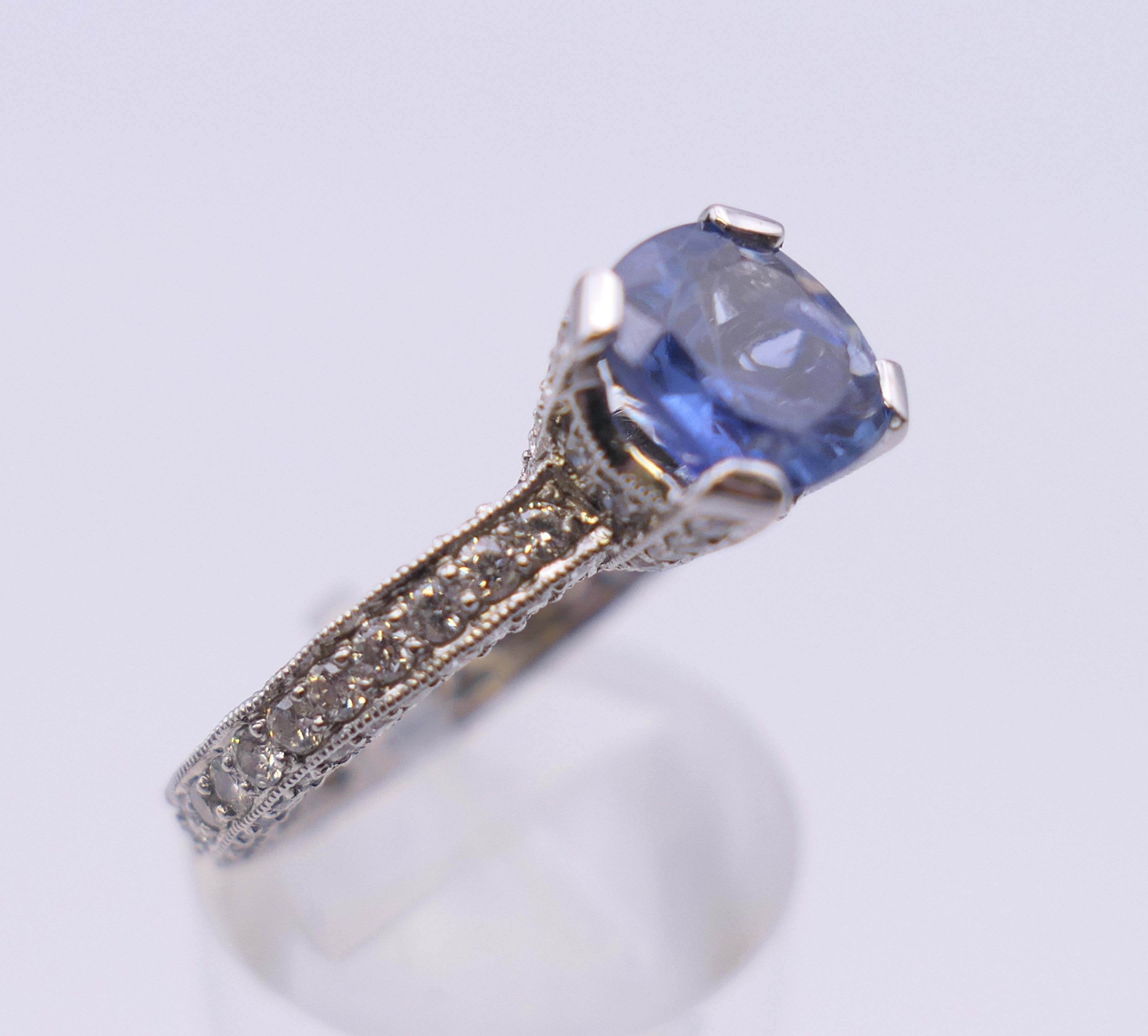 An 18 ct gold sapphire and diamond ring. Total diamond weight approximately 2.5 carats. - Image 4 of 11