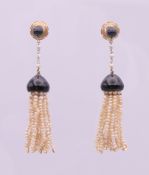 A pair of 18 ct gold seed pearl and enamel drop earrings. 5 cm high.