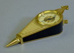 A Le Coultre bellows clock. 17 cm long.