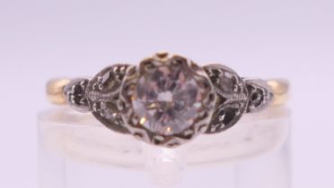 An 18 ct gold and platinum approximately 1/3 carat diamond solitaire ring. Ring size M/N. 2.
