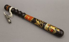 A policeman's truncheon with painted GR cypher and a whistle. The former 37.5 cm long.