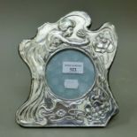 An Art Nouveau style silver photograph frame. 21 cm high.