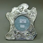 An Art Nouveau style silver photograph frame. 21 cm high.