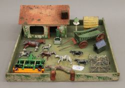 A vintage toy farmyard. 35.5 cm wide.
