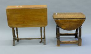 A Victorian mahogany Sutherland table and a 20th century oak drop leaf coffee table.