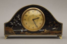 A chinoiserie mantle clock. 24 cm wide.