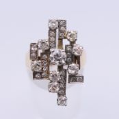 A 9 ct gold diamond set contemporary ring. Ring size N/O. 8.5 grammes total weight.