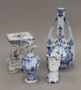 Four pieces of Delft Ware decorated in the traditional blue and white pallet. The largest 25.