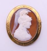 A Victorian cameo carved as an Amazonian Warrior, set in an unmarked high carat gold mount.