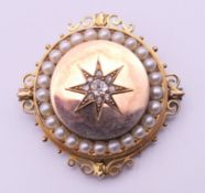 A Victorian unmarked gold seed pearl and diamond set pendant/brooch. 3.5 cm diameter. 13.