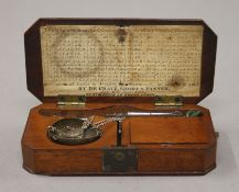 A cased set of antique diamond scales with tweezers. The case 13 cm long.