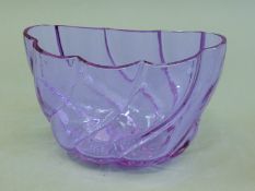 An amethyst glass jelly mould. 20 cm wide.