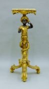 A Blackamoor stand. 92.5 cm high.