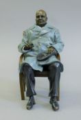 A bronze model of Winston Churchill. 15.5 cm high.