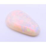 An opal specimen. 2 cm long.