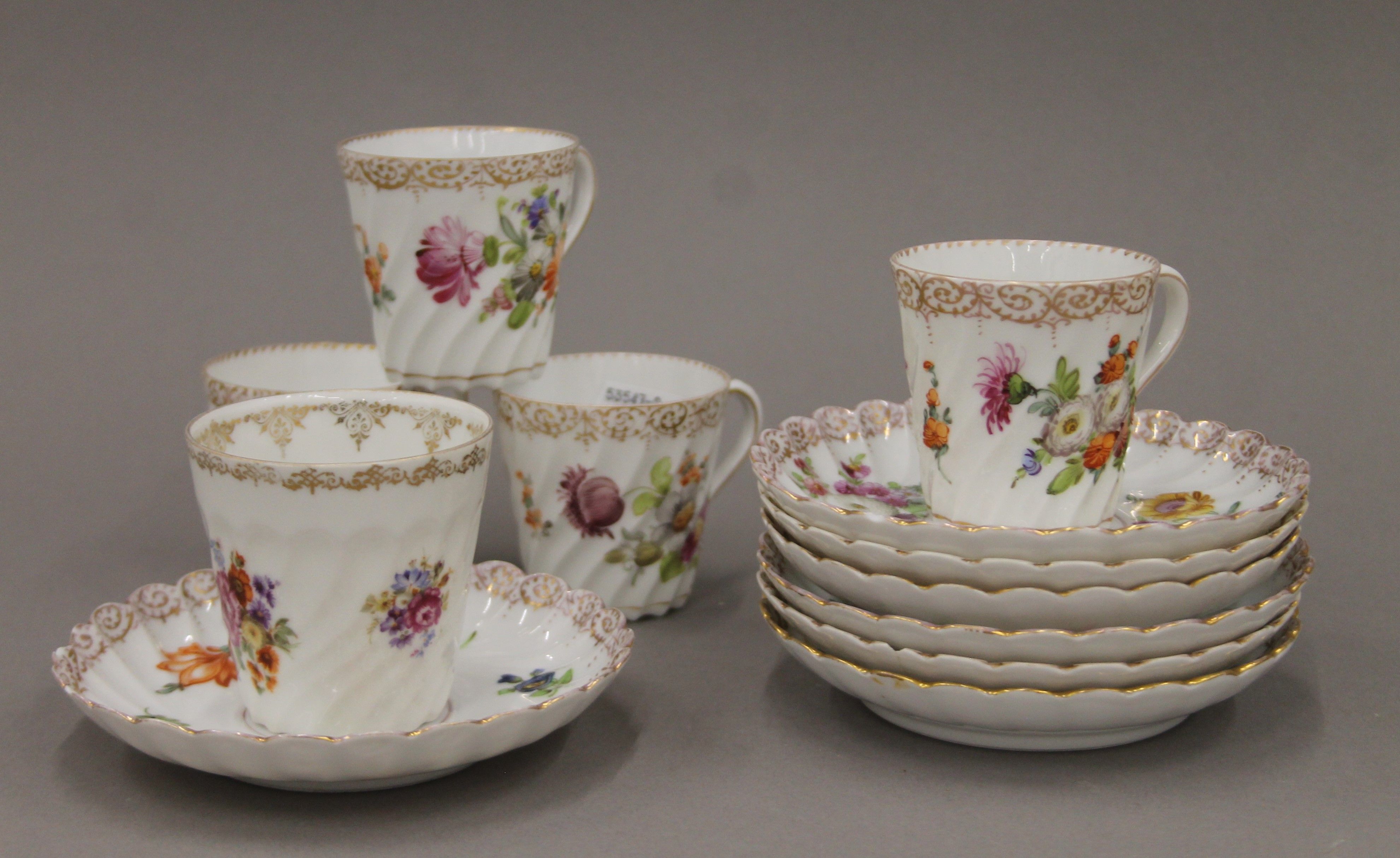 A quantity of Dresden and Vienna porcelain cups and saucers.