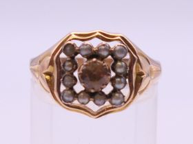 A 15 ct gold Imperial topaz and seed pearl ring, hallmarked 625. Ring size R/S. 4.