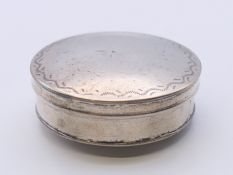 An early 19th century Continental silver pill box. 4 cm diameter.