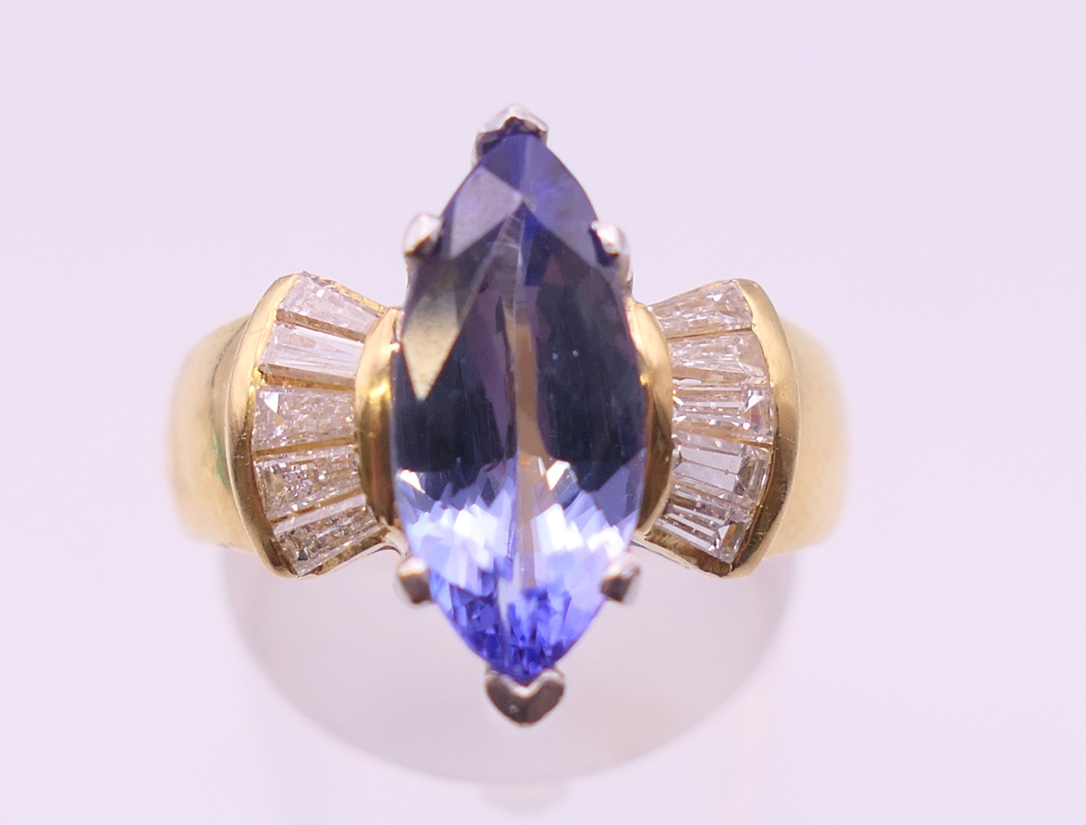 An 18 ct gold tanzanite and baguette diamond ring. Ring size O/P. - Image 5 of 8