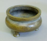 A Chinese bronze censer. 11.5 cm diameter.
