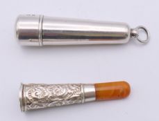 A silver cased amber and silver cheroot holder, hallmarked for Birmingham 1911. 5.5 cm long. 9.
